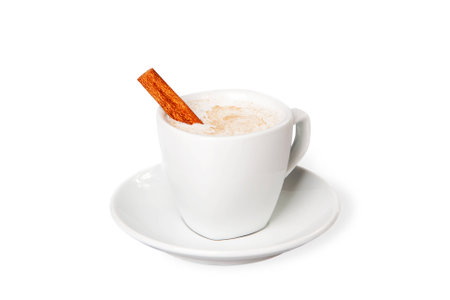 Warm milk with cinnamon on white blackgroundの写真素材