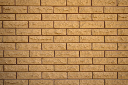 The wall of neatly lined decorative bricks