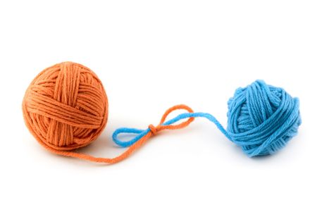 Red and blue thread ball isolated on white backgroundの写真素材