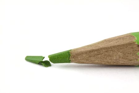 Broken green pencil isolated on white backgroundの写真素材