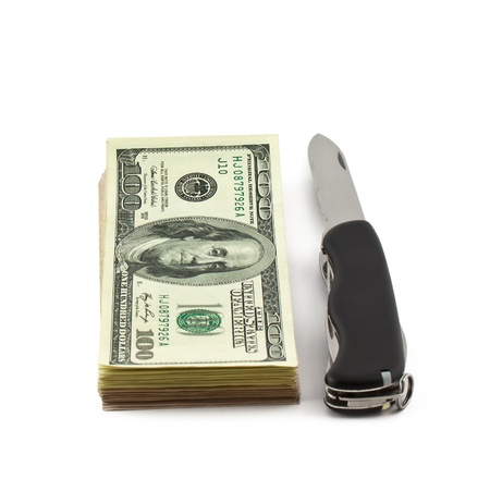 Dollars and knife isolated on whiteの写真素材