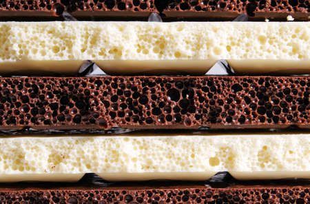 Strips of black and white porous chocolateの写真素材