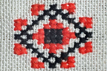 Detail of an ornament of a manual embroidery on a homespun clothの写真素材