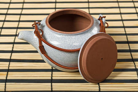 Teapot for seal tea on a napkin from rice strawsの写真素材