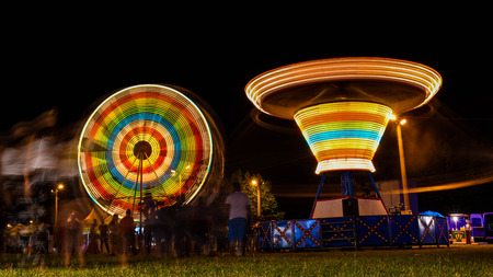 Midway Rides At Fun Fair Night Sceneのeditorial素材