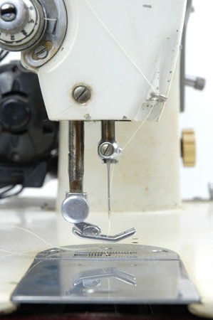 Very old white sewing machine .
