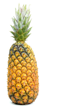 Whole pineapple over a white background. 