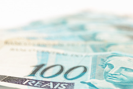 Hundred's of Brazilian real currency background .の写真素材