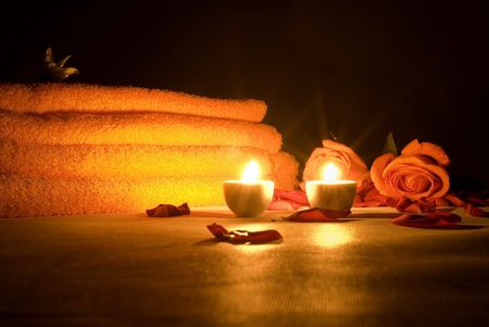 Objects at night - Light Candles and Towel and flowers .の写真素材