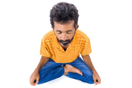 Adult Afro American meditating on white background .の写真素材