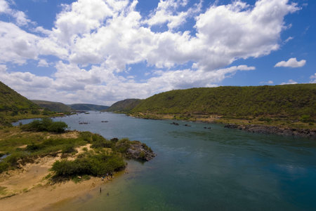 Landscape scene - a River and hills .
