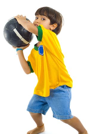 Young Child as goalkeeper, with Yellow T-shirt and a ball .の写真素材