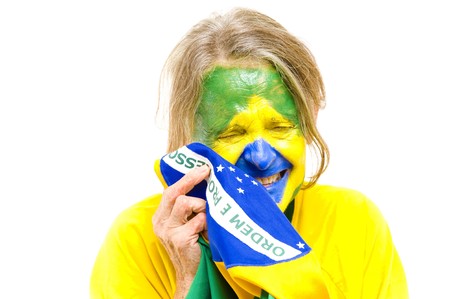 Brazilian sport fan holding a Brazilian Flag and Crying .の写真素材
