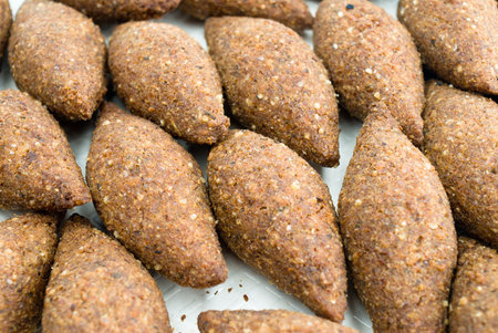 Kibe - delicious fried meat cakes as appetizer .