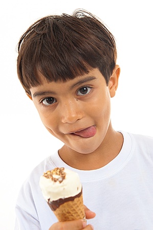 Young boy eating an delicious icecream .の写真素材
