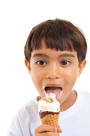 Young boy eating an delicious icecream .の写真素材