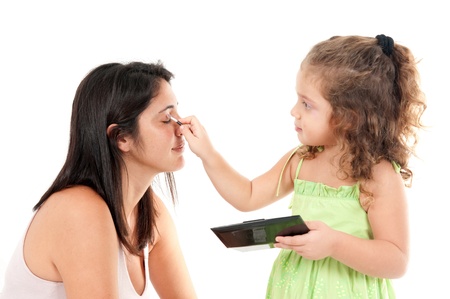 Beautiful woman and child girl on white .の写真素材