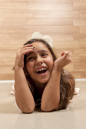 Cute young girl smilling, indoor photo .の写真素材