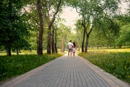 Family love couple in the forest park on a Fairy tale roadの写真素材