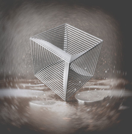 Chrome cube from rods standing standing on one corner in an urban environment with rust, reflecting...