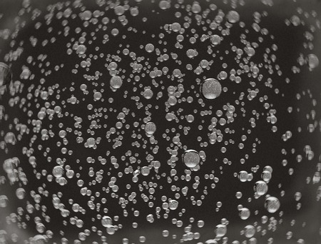 water bubbles abstract 3d rendering on dark bacgroundの写真素材
