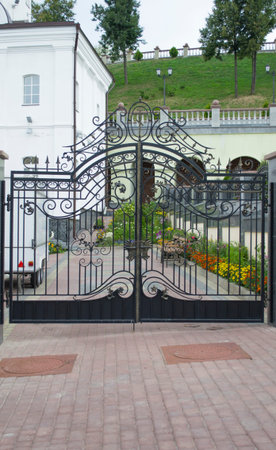 wrought-iron gate in graveyard beackground