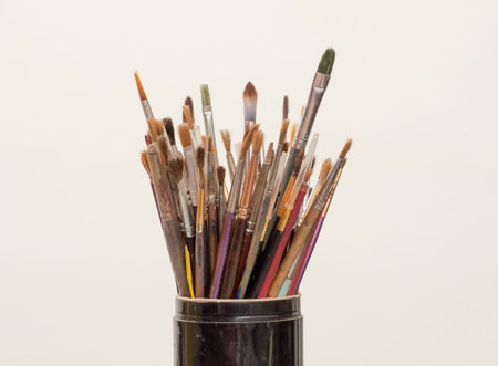 Painter brushes in black jar