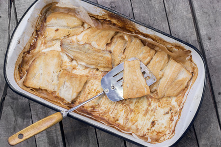 roasted catfish fillets in baking panの写真素材