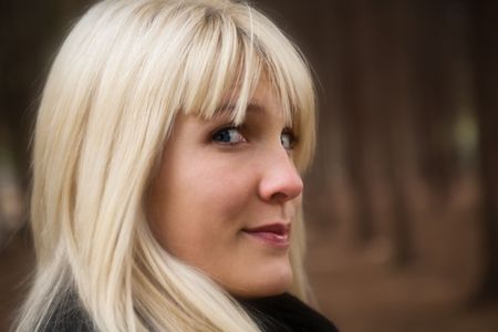 candid blond woman portrait, outdoor shot, selective focusの写真素材