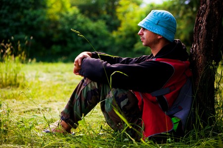 man sitting and relaxing in nature, spring dayの写真素材