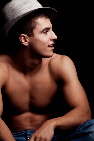 young handsome man with hat portrait, studio shotの写真素材