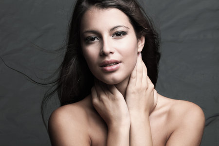 young brunette woman beauty portrait, natural look, studio shot
