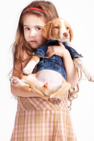 little girl with her adopted dog, studio shotの写真素材