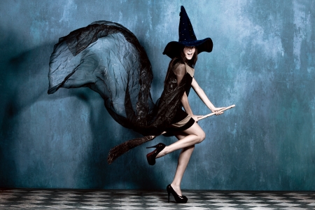 teen witch on her broom ready to flyの写真素材
