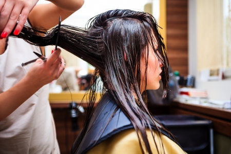 young woman at hairdresser の写真素材