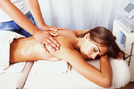 woman in cosmetics salon  back massage treatmentの写真素材