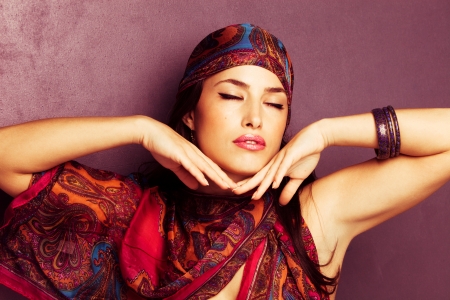 beautiful oriental look young woman portrait with scarf の写真素材