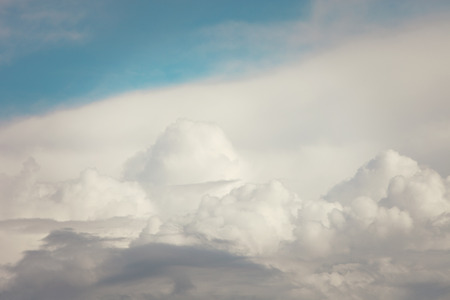 part of light blue sky and fluffy white cloudsの写真素材