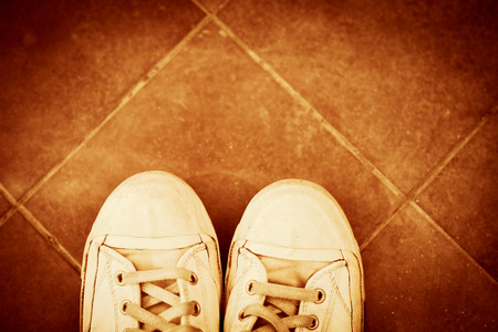 pair of sneakers from  above on tiles retro colorsの写真素材