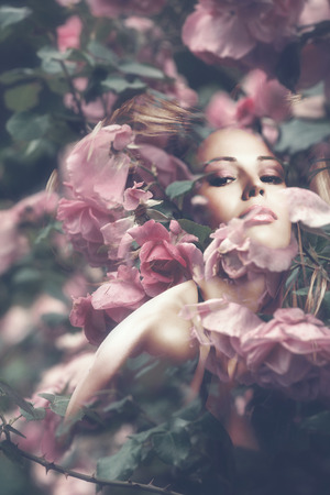 woman beauty portrait with flowers  composite photoの写真素材