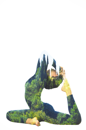 woman in yoga king pigeon position double exposureの写真素材