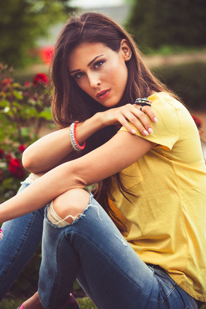 urban young woman portrait in park summer dayの写真素材