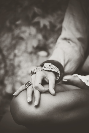 woman hand closeup in meditation yoga position desaturated photoの写真素材