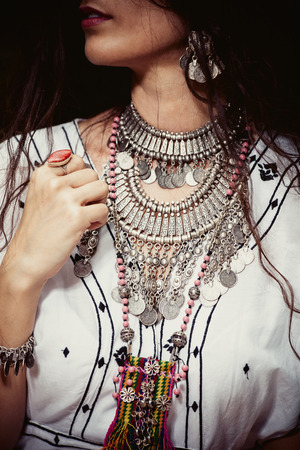 young woman with massive necklace in boho styleの写真素材