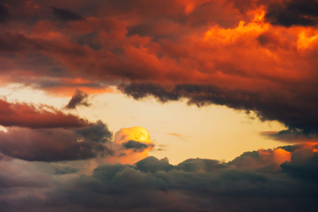 beautiful dramatic winter cloudscape at sunset backgroundの写真素材