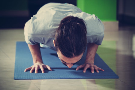 young man doing yoga  indoor healthy lifestyle concept