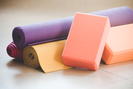 closeup of yoga blocks and mat props indoorの写真素材
