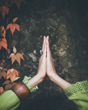 woman doing yoga outdoor closeup of hands の写真素材