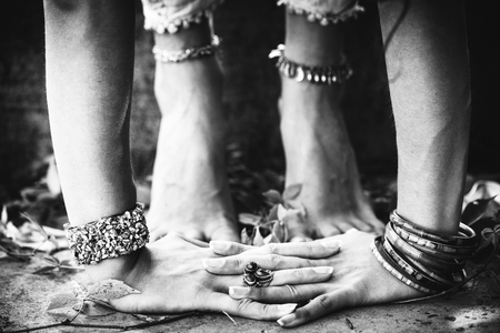 closeup of woman hands and feet practice yoga extension outdoor black and whiteの写真素材