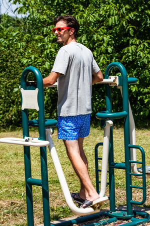 stepper makes fitness exercise outdoor in the parkの写真素材